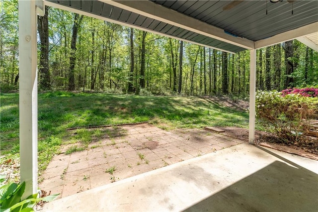 view of patio featuring a wooded view