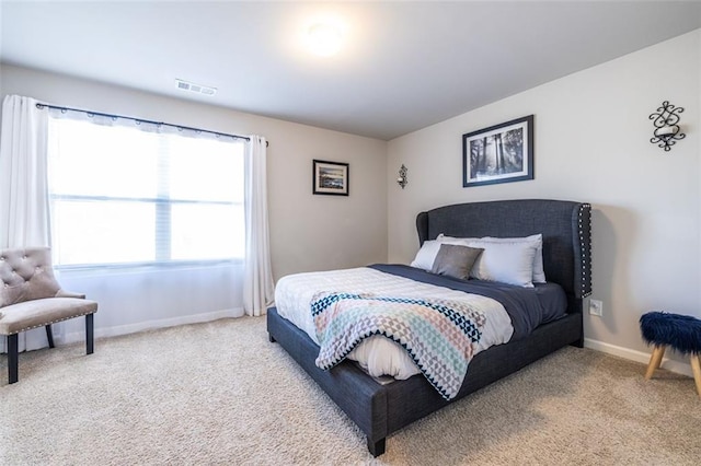 bedroom with light colored carpet