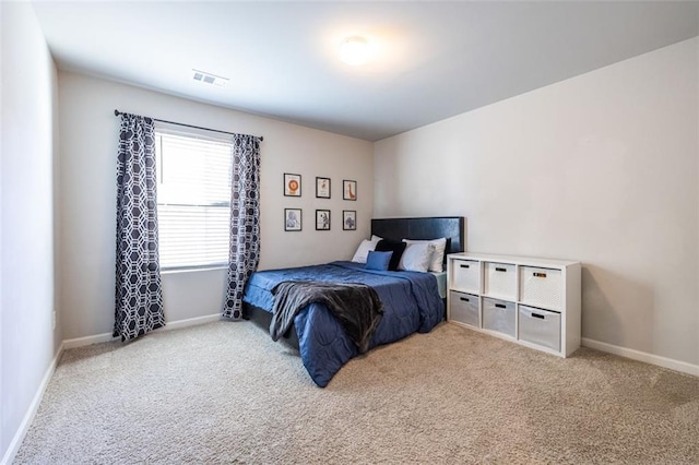 bedroom with light colored carpet