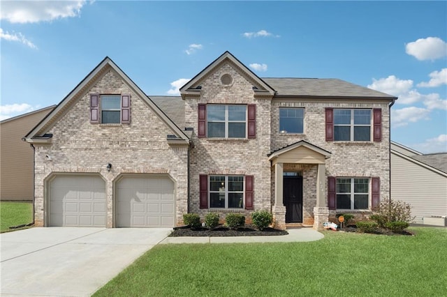 view of front of home featuring a garage, driveway, brick siding, and a front yard