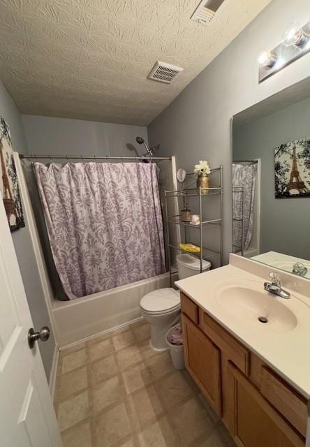 443 Marsh Lake Rd, Lawrenceville, GA 30045 - bathroom featuring vanity, shower / bath combo with shower curtain, tile patterned floors, and a textured ceiling