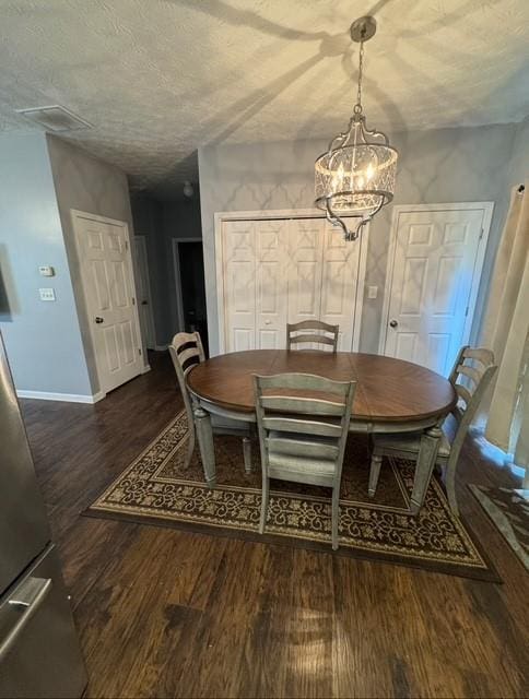 443 Marsh Lake Rd, Lawrenceville, GA 30045 - dining area with wood finished floors, a chandelier, and a textured ceiling