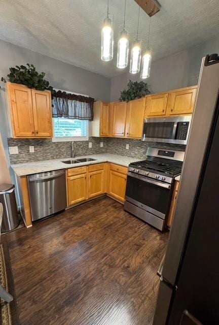 443 Marsh Lake Rd, Lawrenceville, GA 30045 - kitchen featuring appliances with stainless steel finishes, tasteful backsplash, light countertops, dark wood finished floors, and a textured ceiling