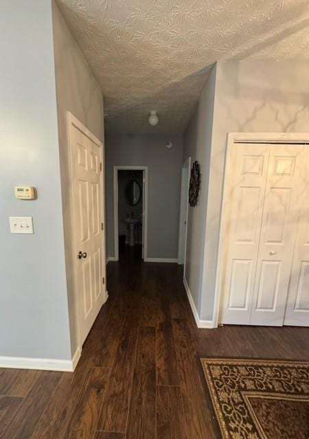 443 Marsh Lake Rd, Lawrenceville, GA 30045 - corridor featuring dark wood finished floors and a textured ceiling
