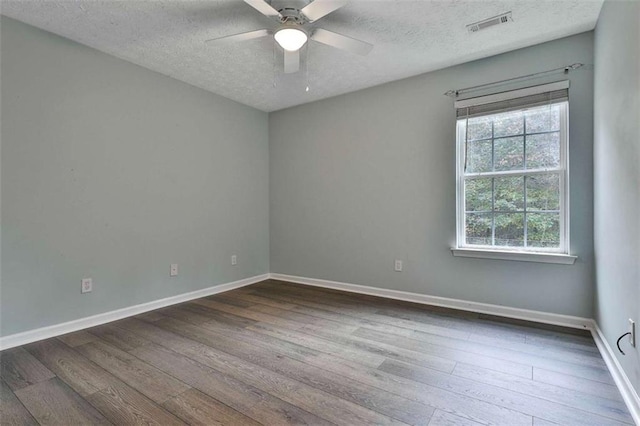 2551 Luther Bailey Rd, Senoia, GA 30276 - empty room with a textured ceiling, dark wood-style floors, and a ceiling fan