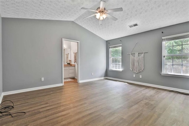 2551 Luther Bailey Rd, Senoia, GA 30276 - unfurnished room with plenty of natural light, ceiling fan, wood finished floors, and vaulted ceiling