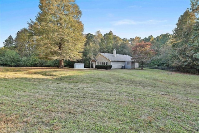 2551 Luther Bailey Rd, Senoia, GA 30276 - view of grassy yard featuring a storage unit and a forest view