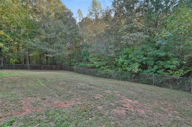 2551 Luther Bailey Rd, Senoia, GA 30276 - fenced backyard with a view of trees