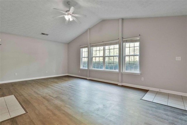 2551 Luther Bailey Rd, Senoia, GA 30276 - spare room with a ceiling fan, a textured ceiling, vaulted ceiling, and wood finished floors