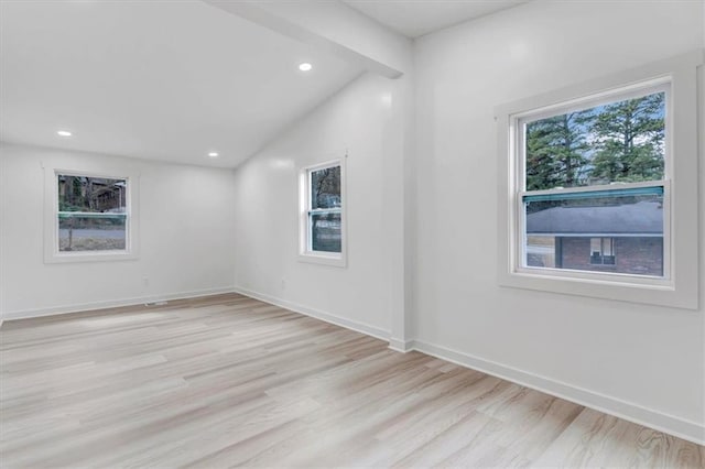 unfurnished room with vaulted ceiling with beams, recessed lighting, light wood-type flooring, and baseboards