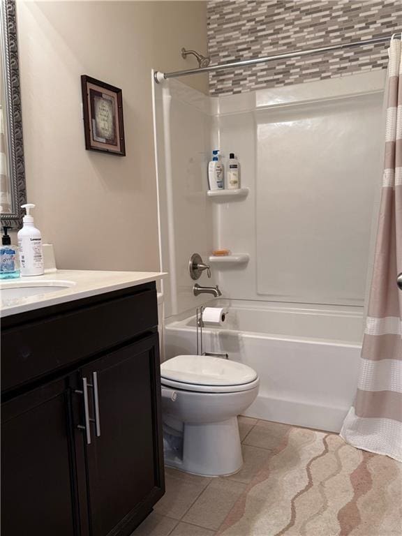 full bathroom with shower / bath combination with curtain, toilet, vanity, and tile patterned floors