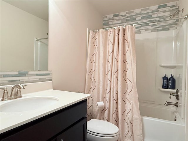 bathroom featuring toilet, vanity, and shower / bathtub combination with curtain