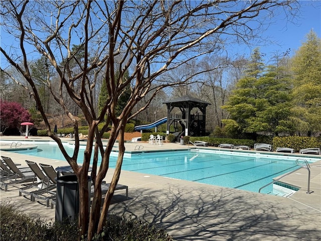 community pool with a patio area