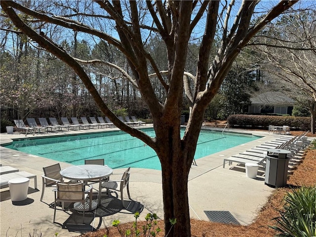 community pool with a patio