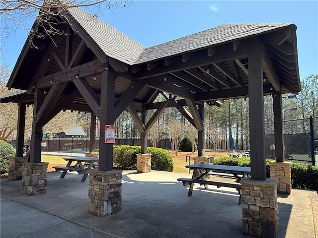 view of community with a gazebo and fence