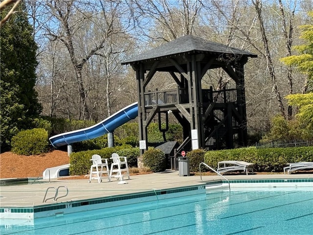 community pool with a water slide