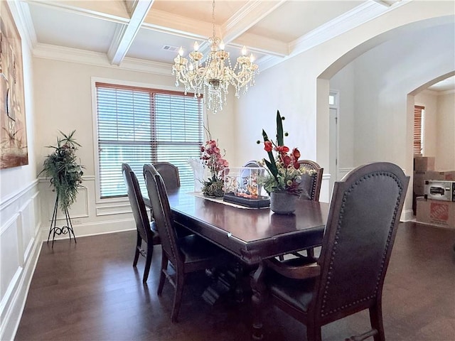 dining space featuring dark wood-style flooring, a decorative wall, visible vents, beamed ceiling, and arched walkways