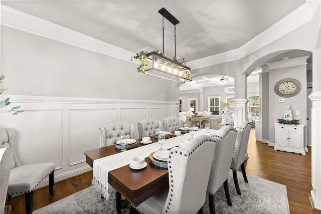 2213 Independence Ln, Buford, GA 30519 - dining space with ornamental molding, a decorative wall, ornate columns, arched walkways, and ceiling fan
