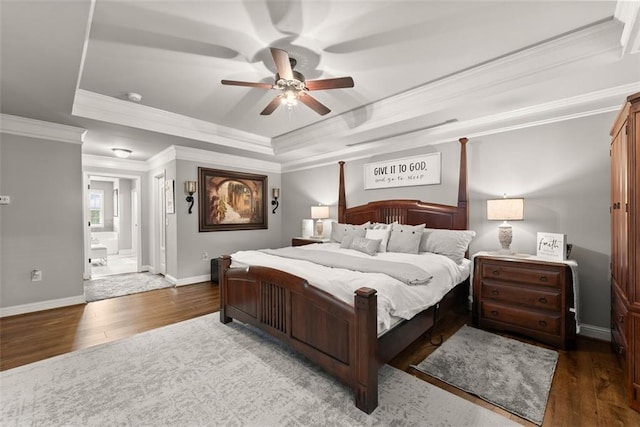 2213 Independence Ln, Buford, GA 30519 - bedroom featuring wood finished floors, a tray ceiling, crown molding, connected bathroom, and ceiling fan