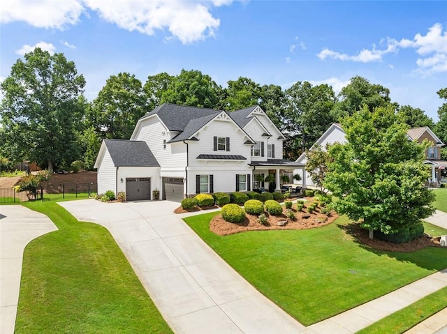 2213 Independence Ln, Buford, GA 30519 - modern farmhouse style home featuring concrete driveway, a standing seam roof, a garage, and a metal roof