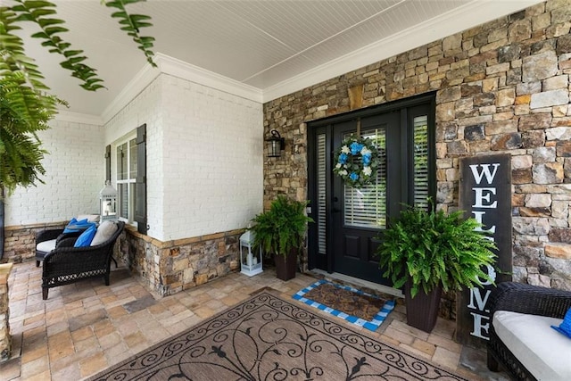 2213 Independence Ln, Buford, GA 30519 - property entrance featuring a porch, brick siding, and stone siding