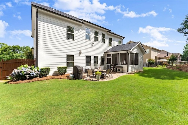 2213 Independence Ln, Buford, GA 30519 - rear view of house featuring a sunroom and a patio area