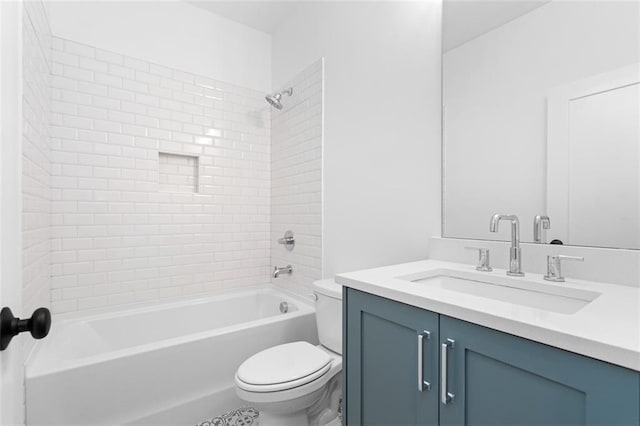bathroom with shower / bathtub combination, vanity, and toilet