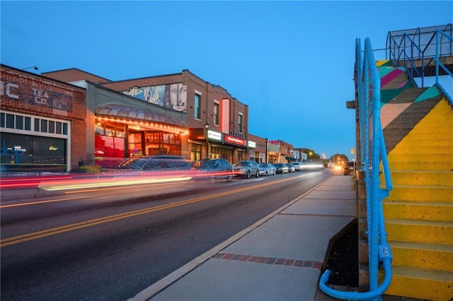 view of street with sidewalks and curbs