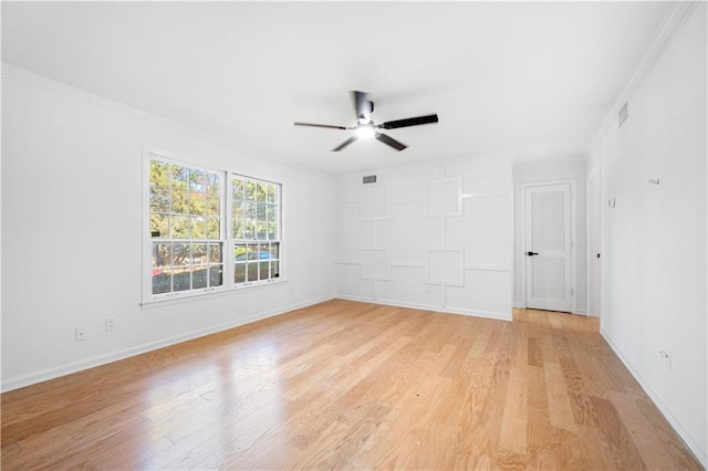 unfurnished room featuring ceiling fan, light hardwood / wood-style floors, and ornamental molding