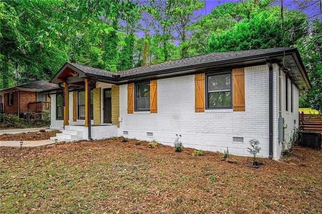 view of front of home with central AC and a porch