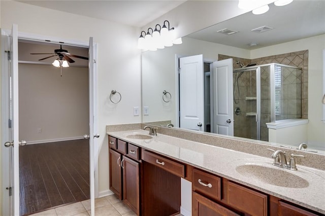 bathroom featuring vanity, tile patterned floors, ceiling fan, and walk in shower