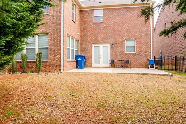 rear view of property featuring french doors and a patio