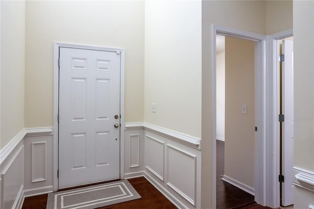 doorway to outside with dark wood-type flooring