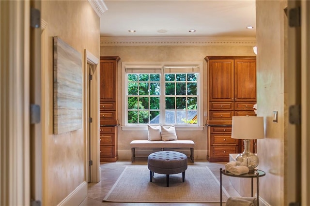 living area with crown molding