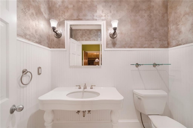 bathroom featuring sink and toilet