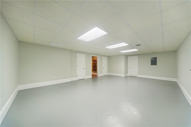 basement featuring a paneled ceiling