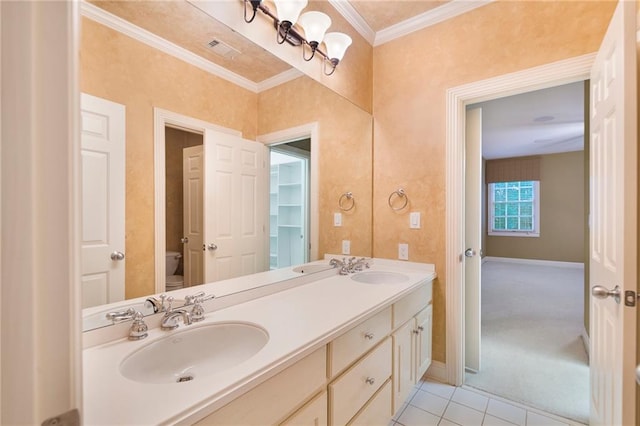 bathroom with toilet, tile floors, ornamental molding, and double vanity