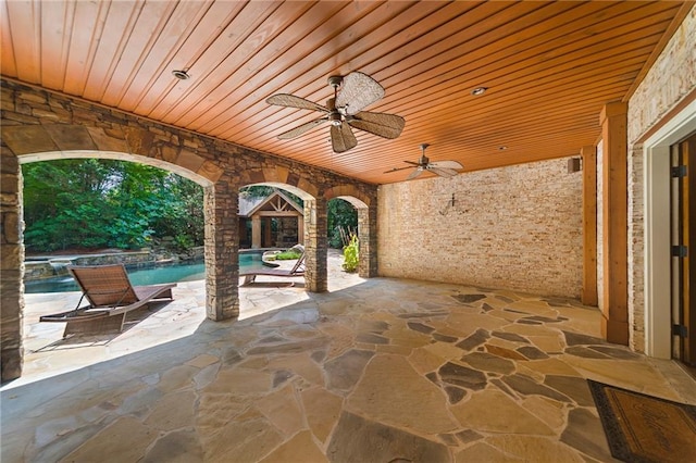 view of patio featuring ceiling fan