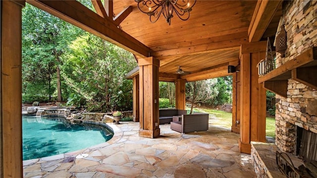 view of patio with an outdoor stone fireplace