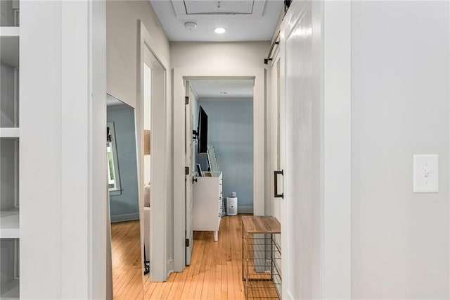 corridor with light wood-type flooring