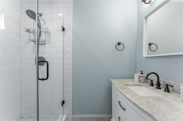 bathroom with vanity and walk in shower