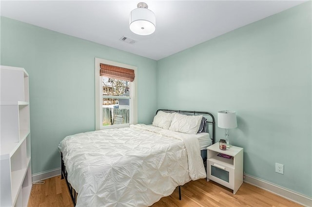 bedroom featuring light wood-type flooring