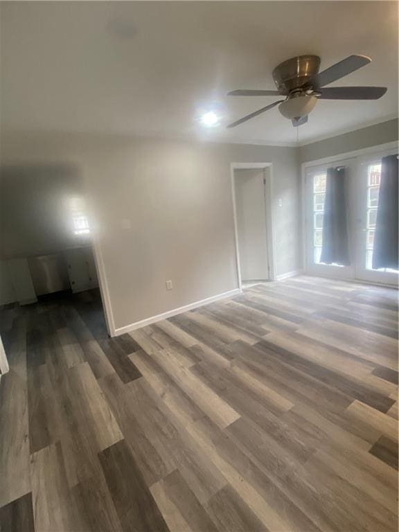 1905 Robinhill Ct, Tucker, GA 30084 - empty room featuring dark wood-style floors, baseboards, and a ceiling fan