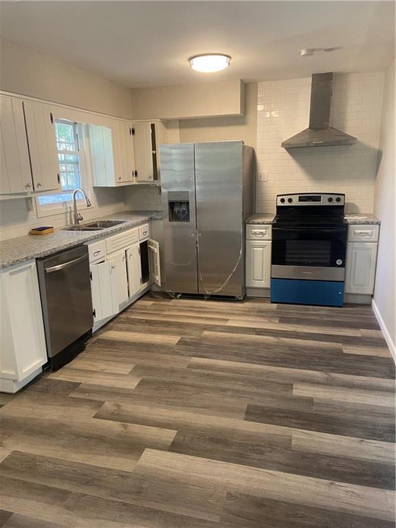 1905 Robinhill Ct, Tucker, GA 30084 - kitchen with stainless steel appliances, wall chimney exhaust hood, a sink, dark wood finished floors, and backsplash