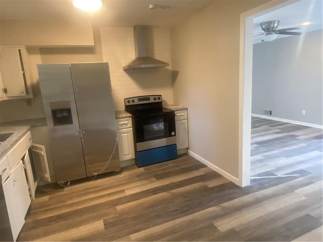 1905 Robinhill Ct, Tucker, GA 30084 - kitchen with appliances with stainless steel finishes, wall chimney range hood, white cabinetry, and dark wood-style floors