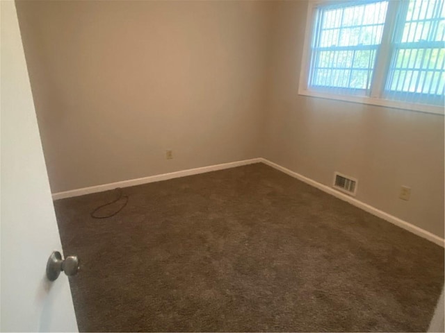1905 Robinhill Ct, Tucker, GA 30084 - empty room featuring baseboards and dark colored carpet