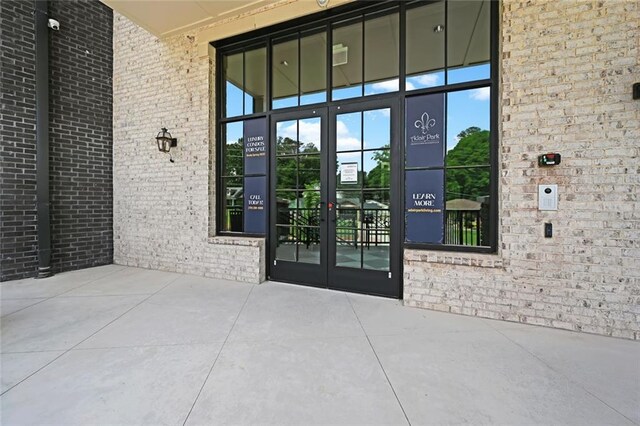 8200 Main St Unit 1206, Woodstock, GA 30188 - doorway to property featuring french doors and brick siding