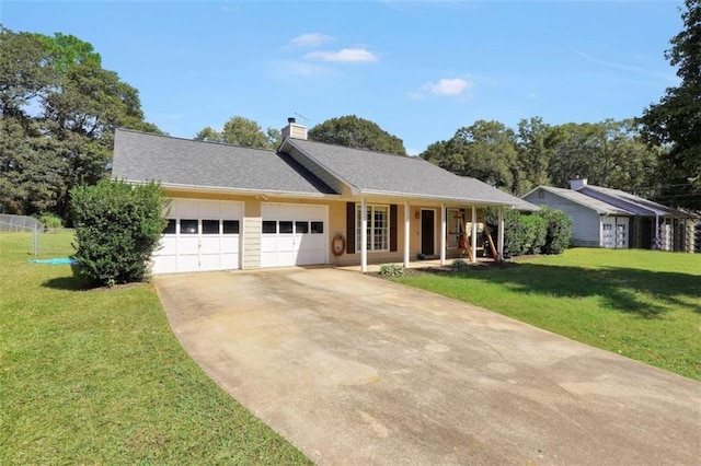 single story home featuring covered porch, a garage, and a front yard