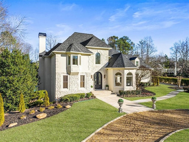 2470 Hopewell Plantation Dr, Milton, GA 30004 - french country style house with a chimney, a front lawn, stone siding, and stucco siding
