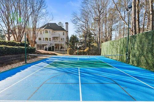 2470 Hopewell Plantation Dr, Alpharetta, GA 30004 - view of basketball court with a tennis court and fence